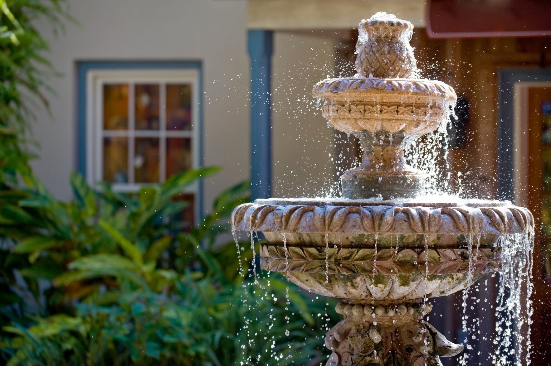 Two-tiered garden fountain flowing with water (copy)